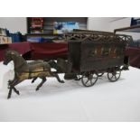 A Late XIX Century Tinplate Model of a Two Horse Drawn Four Wheel Omnibus, double decker with top