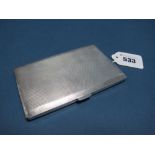 A Hallmarked Silver Cigarette Case, FF, Birmingham 1961, of rectangular form, allover engine turned,