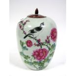 A Late XIX Century Chinese Jar and Wooden Cover, of ovoid form, painted with a bird perched on a