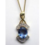 A 9ct Gold Fluorite and Diamond Set Pendant, oval four claw set to the centre, within brilliant