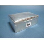 A Hallmarked Silver Cigarette Box, (makers mark rubbed) London 1917, of plain rectangular form,