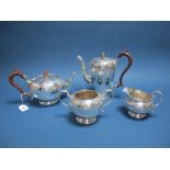 A Decorative Plated Four Piece Tea Set, each with chased decoration and leaf capped scroll