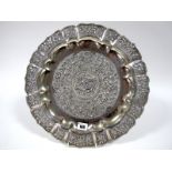 A Charger, of shaped circular form, pierced and detailed in relief with exotic birds, flowers and