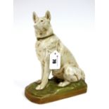 A Royal Dux Pottery Model of a Seated Dog, upon a rocky green rectangular base, shape number 2346,