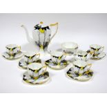 A 1930's Shelley Porcelain Coffee Service in the "Sunset and Tall Trees" Pattern, in black and