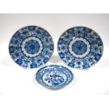 A Pair of Late XIX Century Dutch Tin Glazed Chargers, painted in blue with an elaborate design of