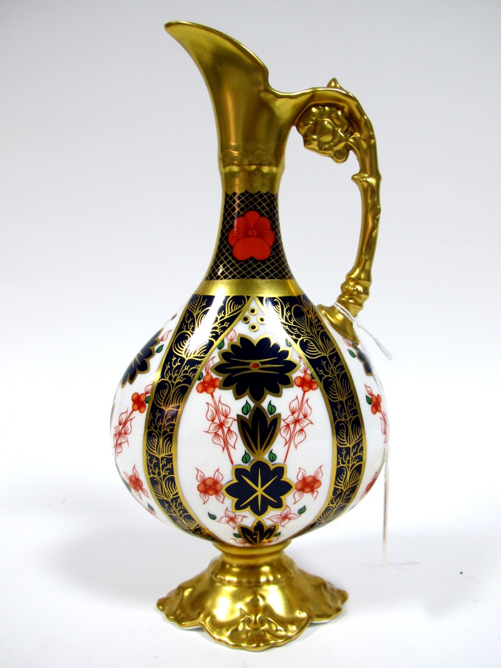 A Royal Crown Derby Porcelain Old Imari 1128 Ewer, on flattened pear shaped single handed form,