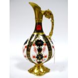 A Royal Crown Derby Porcelain Old Imari 1128 Ewer, on flattened pear shaped single handed form,