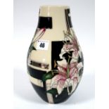 A Moorcroft Pottery Vase, of pear shape form, painted in the 'Trial' Stargazer pattern, designed