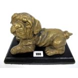 A Late XX Century Brass Model of a Pug Dog, in recumbent pose, black wooden rectangular base, 22.5cm