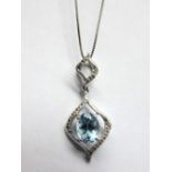 A 9ct White Gold Aquamarine Set Pendant, oval four claw set to the centre, on openwork bale, on