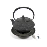 A Late XIX Century Chinese Cast Iron Teapot, Cover and Stand, with a glass liner, the teapot of