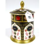 A Royal Crown Derby Porcelain Old Imari 1128 Tea Caddy, of cylindrical form with acorn finial,