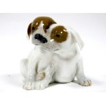 A Mid XX Century Copenhagen Porcelain Model of Two Pointer Puppies, each with brown patches,