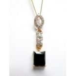 An 18ct Gold Lajao Tourmaline and Diamond Set Drop Pendant, rectangular four claw set below claw set