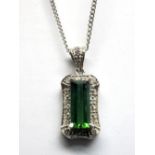 A Santa Rosa Tourmaline and Diamond Set Pendant, of Art Deco Style, elongated rectangular set to the