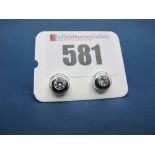 A Pair of 18ct White Gold Single Stone Diamond Earstuds, each wide circular collet rubover set