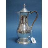 A Hallmarked Silver Coffee Pot, Charles Wright, London 1775, of plain baluster form with beaded