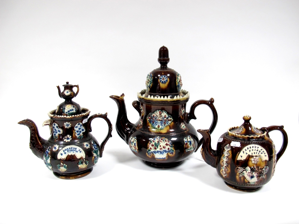 A Mid XIX Century Barge Ware Teapot and Cover, with teapot finial, applied with flowers and