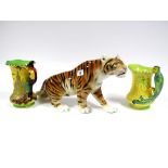 A Mid XX Century Royal Dux Model of a Prowling Tiger, paper label, 50cm long; A Burleigh Ware '