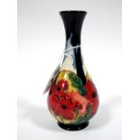 A Moorcroft Pottery Vase, of baluster form, painted in the Forever England pattern, designed by