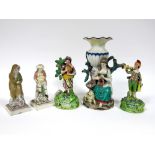 A Pair of Walton Pearlware Pottery Figures of Musicians, she playing the tambourine, he the trumpet,