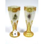 A Pair of Royal Worcester Porcelain Vases, of elongated lobed form raised on leaf moulded blush