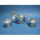 A Hallmarked Silver Three Piece Tea Set, E.S.B, Birmingham 1911, each of plain form with reeded