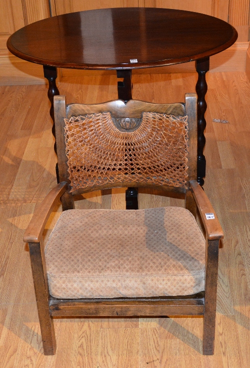 A mahogany oval occasional table, 73cm high x 85cm wide, also with vintage child's bergere armchair,