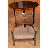 A mahogany oval occasional table, 73cm high x 85cm wide, also with vintage child's bergere armchair,