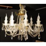 A crystal chandelier, with eight scroll branches,