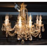 A crystal chandelier, with eight scroll branches,