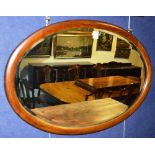 A vintage mahogany framed oval mirror,