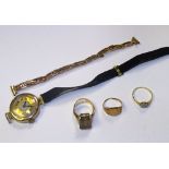 A mixed lot of scrap gold, comprising of smoky quartz ring on 9ct shank, three 9ct gold rings,