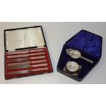 A boxed silver tea strainer with bowl stand, hallmarks for Birmingham 1925-26 and 1929-30, S Ltd,