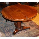 A 19th century mahogany snap top circular table, raised on faceted column and platform base,