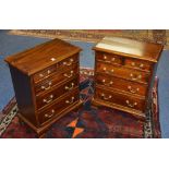 A pair of reproduction mahogany chests of drawers,