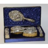 An Art Nouveau composite silver backed brush set, hallmarks for Sheffield,