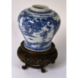 A small Chinese blue and white ovoid vase, on hardwood stand,