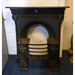 A vintage painted cast iron fireplace, with insert,