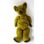 A vintage plush teddy bear,