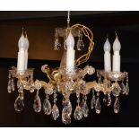 A crystal chandelier, with six scroll branches,