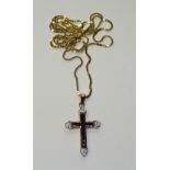 A 9ct gold sapphire and diamond crucifix, on 10ct gold chain,