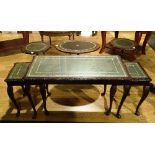 An oak nest of three tables, with green leather skiver to tops under glass,