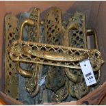 A collection of period brass door handles and door plates,