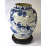 A Chinese blue and white ovoid vase, on hardwood stand,