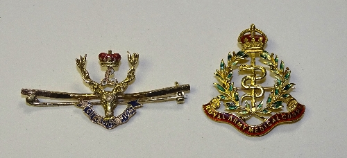 Two 15ct gold enamel military badges,