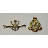 Two 15ct gold enamel military badges,