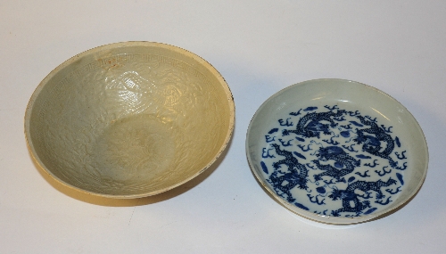 A Chinese Ding Ware bowl circa 19th century, with impressed floral decoration on pale ground,