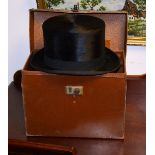 A black silk top hat by JC Smith Ltd, Edinburgh & St Andrews, with leather seam around the interior,